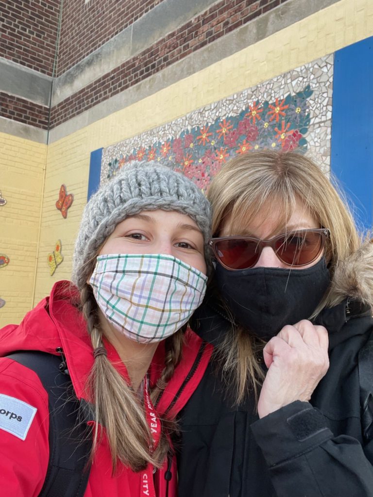 AmeriCorps member and daughter pose for selfie